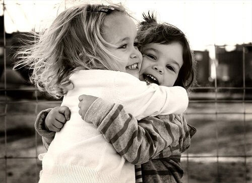 Two children hugging