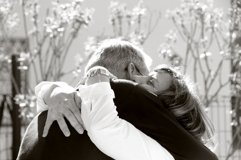 Two people embracing in a classic hug